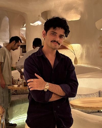 Aditya Raj, the man behind Gleuhr marketing and the founder of ManSkill, posing for a photo at a fine dine restaraunt